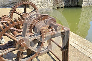 Rusty old cog wheels and pulleys