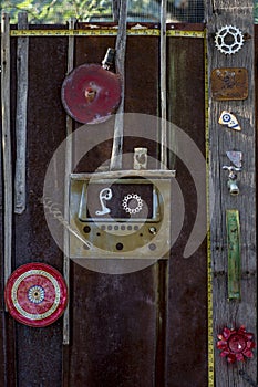 Rusty old Gate With Eclectic Americana arrangement of crafty found art