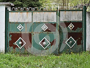 Rusty old green door gate