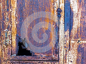 Rusty old iron box with a leaky door.