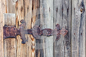 Rusty old iron door hinge