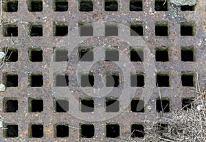 Rusty old iron grid on the canal