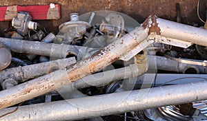 Rusty old iron pipes and other ferrous material