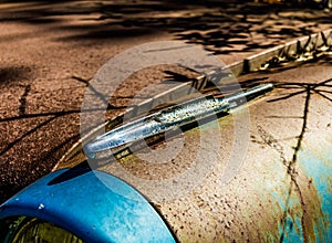 Rusty, old, junked car in the woods