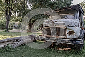 Rusty Old logging truck on old traditional farm area