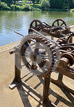 Rusty old machine with cog wheels and levers