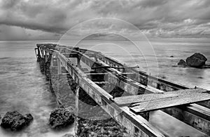 Rusty old pier in a cloudy day