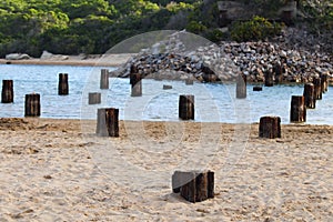 Rusty Old Remnant Bridge Base Struts Over Riverbank