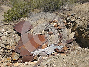 Rusty Old Scrap Metal on Ground in Desert