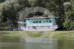 Rusty old ship on the banks of the river