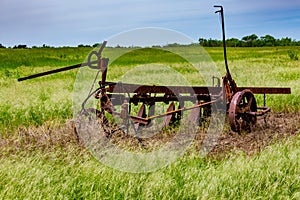 Rusty Old Texas Metal Farm Equipment in Field