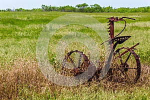 Rusty Old Texas Metal Farm Equipment in Field