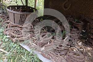 Rusty, old tools, parts, horseshoes collection