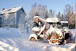 Rusty old tractors left in the snow