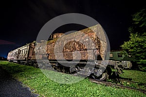 Rusty old train wagon at night