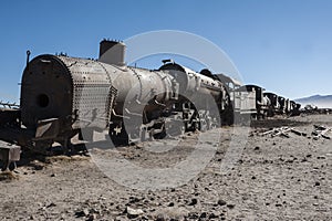 Rusty old trains at the Train Cemetery Cementerio de Trenes in Uyuni desert, Bolivia photo