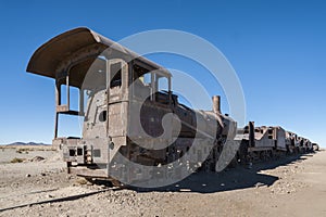 Rusty old trains at the Train Cemetery Cementerio de Trenes in Uyuni desert, Bolivia photo