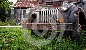 Rusty old truck in farm field