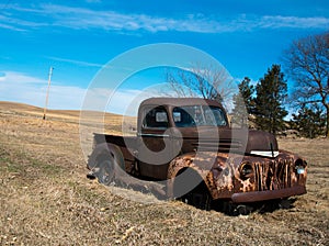 Rusty old truck in field Abandoned