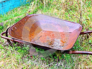 Rusty Old Wheel Barrow in the woods.