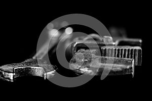 Rusty, old workshop keys. Hydraulic keys on a black table in a w