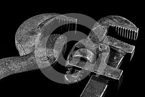 Rusty, old workshop keys. Hydraulic keys on a black table in a w