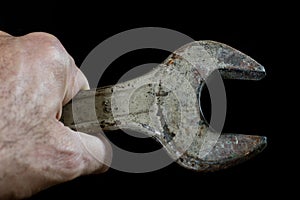Rusty, old workshop keys. Hydraulic keys on a black table in a w