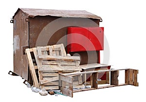 Rusty outdoor metal shed for storage of construction tools