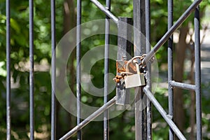 Rusty padlock on the gate