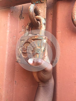 rusty padlock on a gate or Locked up.