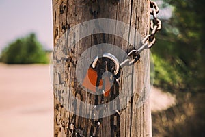 Rusty padlock closing the gate