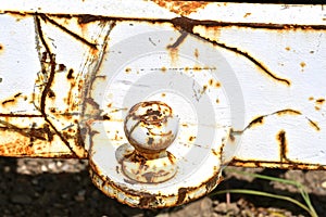 Rusty painted white ball of a trailer hitch