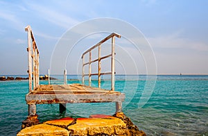 Rusty Pier and blue sea