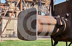 Rusty railway wagon buffer on old train photo