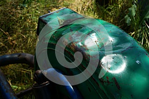Rusty rear chain and sprocket of motorcycle wheel