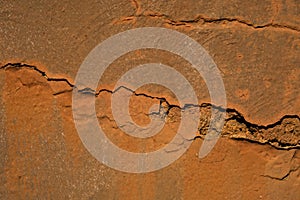 Rusty red cracked stone wall/grunge wall texture background