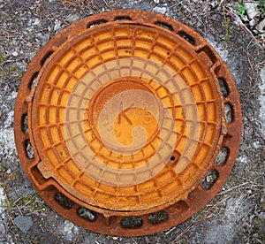 Rusty red sewer hatch