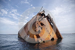 The rusty remains of a sunken ship