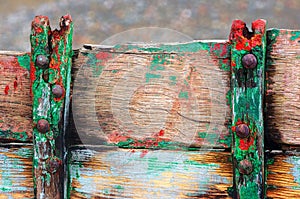 Rusty rivets on old and cracked boat