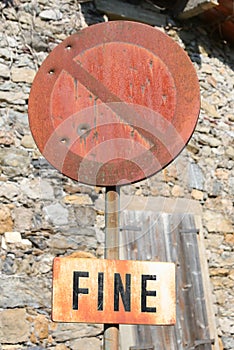 road sign no parking with bullet holes used by hunters as a targ photo