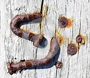 Rusty screws on old wall