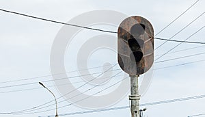 Rusty semaphore on railway tracks