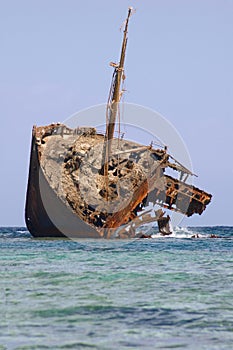 Rusty ship run aground photo