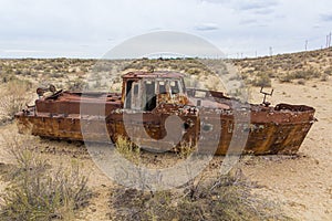 Rusty ship at the ship graveyard in former Aral sea port town Moynaq Mo ynoq or Muynak , Uzbekist