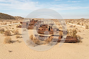 Rusty ships at the ship graveyard in former Aral sea port town Moynaq Mo ynoq or Muynak , Uzbekistan