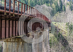 Rusty railway bridge over the river