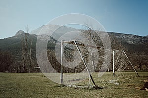 Rusty soccer goal post in an abandoned old field near Majaelrayo, Spain