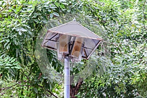 Rusty speakers with rainproof roof for announcement broadcasting
