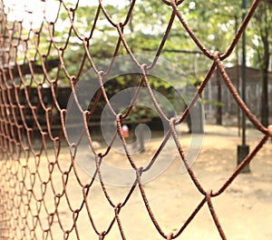 Rusty steel net wire mesh fence