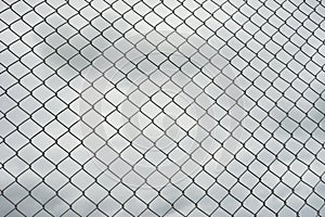 Rusty steel wire mesh fence , cloud in background